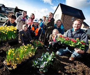 Pupils plant spring flowers for our residents at The Woodlands