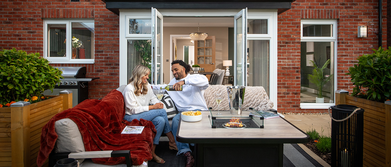 Customers outside a Story home with the French doors open